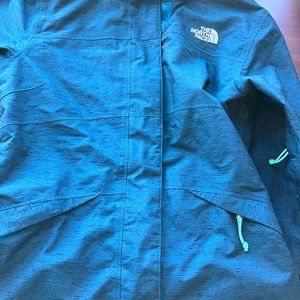 Women’s North Face blue and teal inside spring rain jacket size extra small.